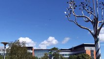 NHS Spitfire flies over Queen Alexandra Hospital in Portsmouth