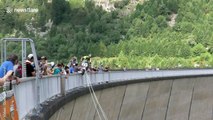 Austrian daredevil leaps from 131-metre dam on Vespa scooter