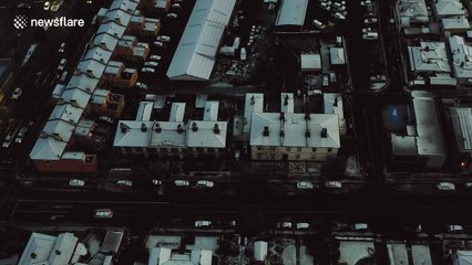Aerial footage shows snow blanketing Tasmania town for the first time in 30 years