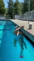 Watch Olympic swimmer Katie Ledecky swim the entire length of a pool with a glass on her head