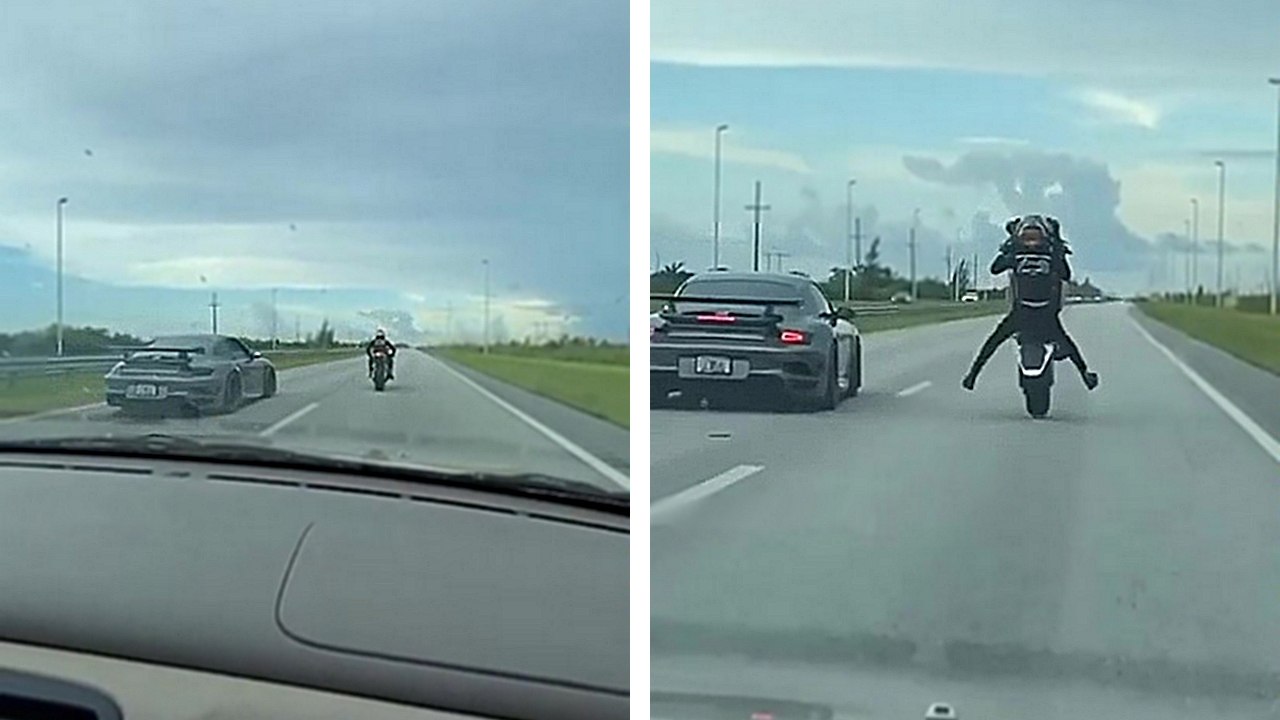 Un motard fait la course contre une Porsche