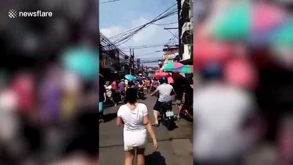 Shoppers ignore social distancing despite Covid-19 spike in the Philippines