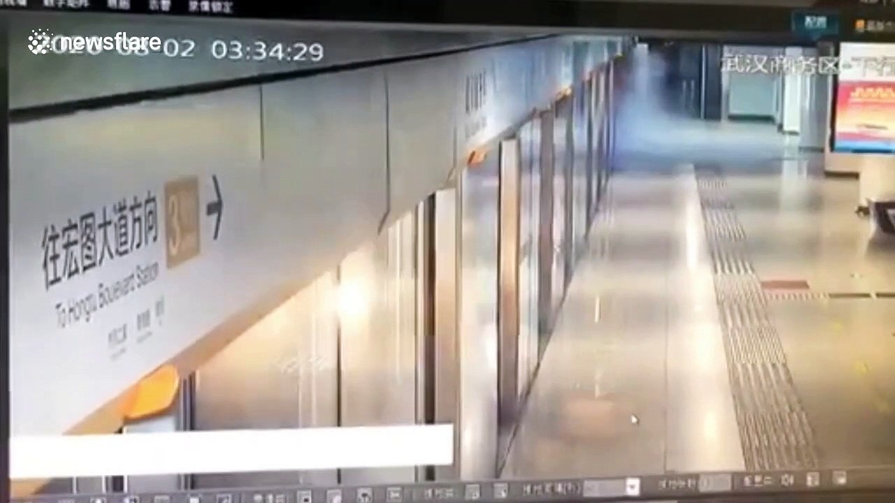 Construction vehicle crashes into Chinese train station, smashes row of platform doors