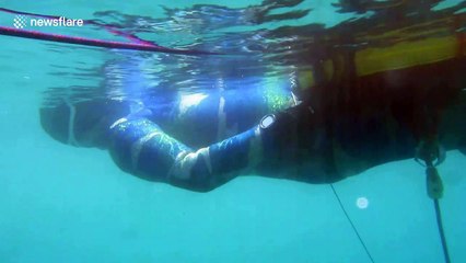 Eerie footage shows Slovakian freediver descend into murky abyss