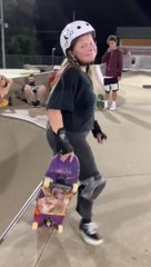 Girl Falls While Sliding Down Slope On Skateboard