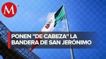 Bandera monumental de San Jerónimo es colocada de cabeza