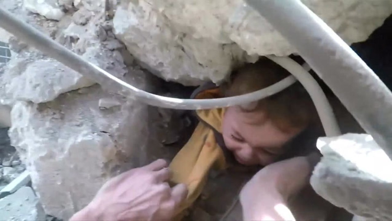 Syrian child pulled from rubble in Eastern Ghouta