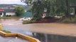 Car stranded in flooded parking lot