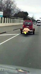 Overloaded Van Trailer Has Some Trouble