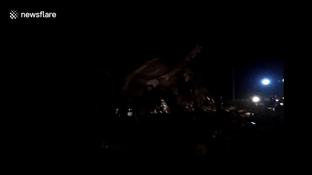 Chaotic scenes at India airport after plane skids off runway and breaks into two, killing passengers