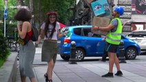 Practical joker terrifies passers-by with falling boxes prank