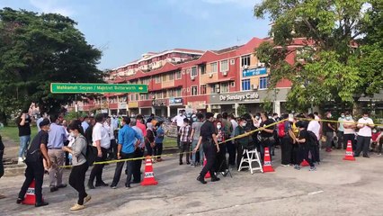 Media personnel wait outside Butterworth court compound ahead of Guan Eng’s graft case
