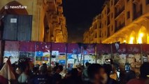 Protesters in Beirut launch projectiles over barricade leading to parliament