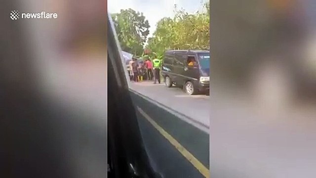 Motorcyclists jump for their lives as truck rolls backwards while smashing into cars