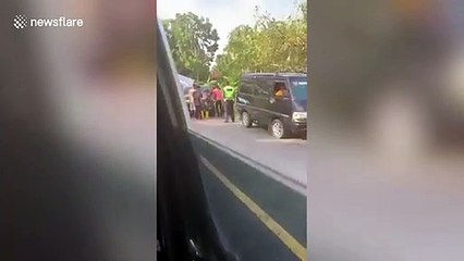 Motorcyclists jump for their lives as truck rolls backwards while smashing into cars