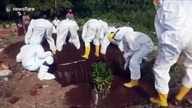 Medics bury Covid-19 'victim' by hand after terrified locals refused to lend them shovels