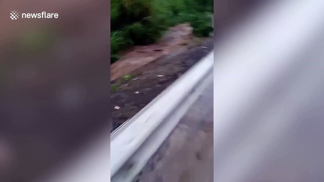 Heroic men save two girls washed away in overflowing river in the Philippines