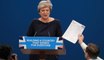 Prankster and coughing fit mar Theresa May's speech