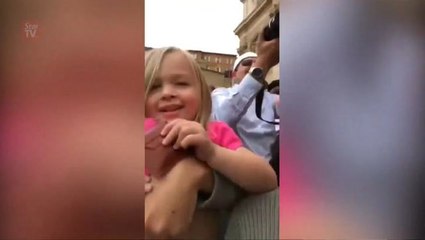 Girl yanks cap off Pope Francis' head