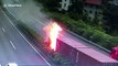 Chinese driver jumps out of truck to escape after the vehicle crashes into central reservation and catches fire