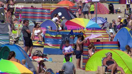 Brits hit the beach as heatwave continues