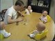 Cute quadruplets laughing with father