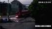 Chinese man narrowly escapes being crushed by truck after jumping off his scooter