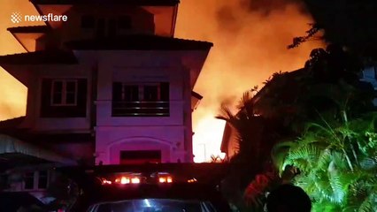 Fire injures two and rips through 90 homes in Bangkok, Thailand