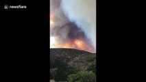 Family flees blaze near their home as California wildfire rages