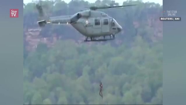 Boys rescued from flooded river in India