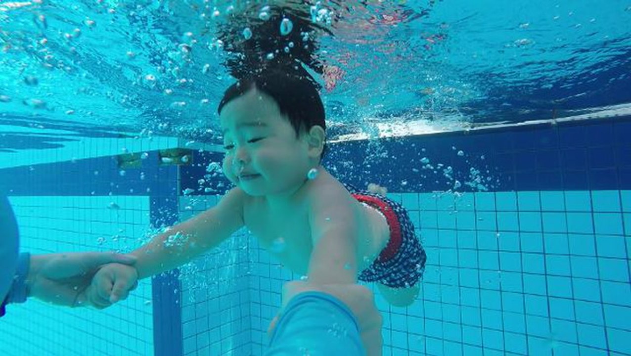 Babies learn life-saving skills in swim class