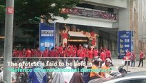 Red-shirt rally-goers gather at Sogo