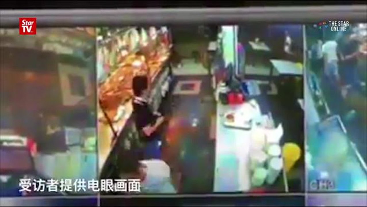 Two charged for wrecking Singapore porridge restaurant