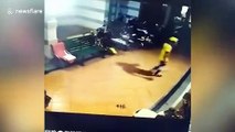 Glass door shatters after delivery man forces it open in China