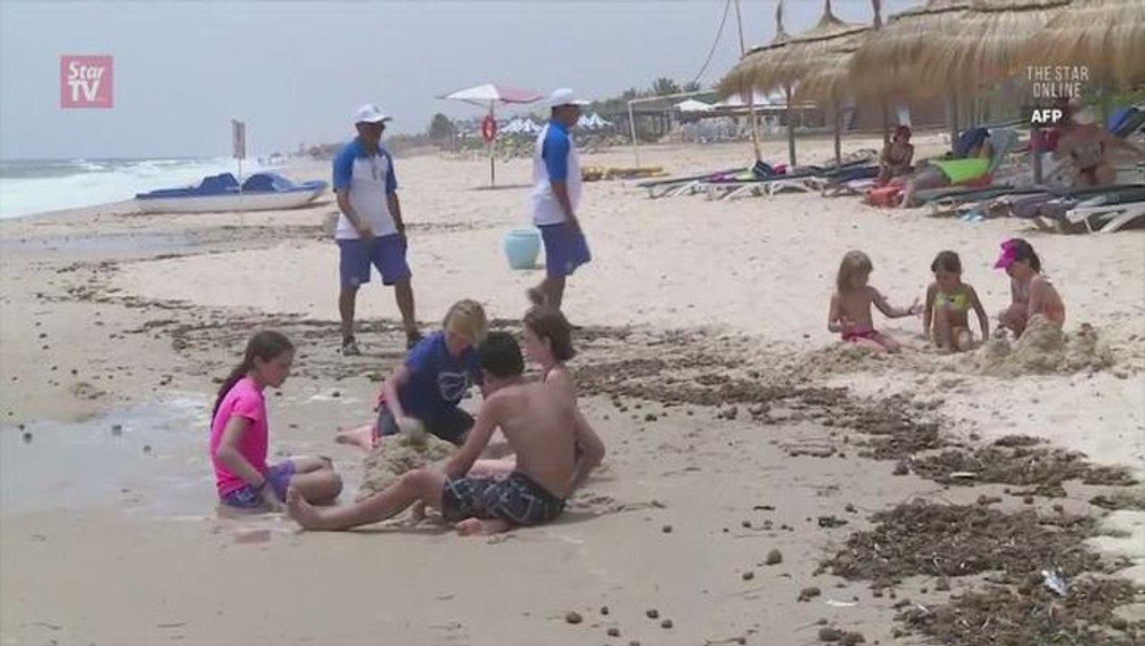 Tunisia flaunts seaside security year after bea...