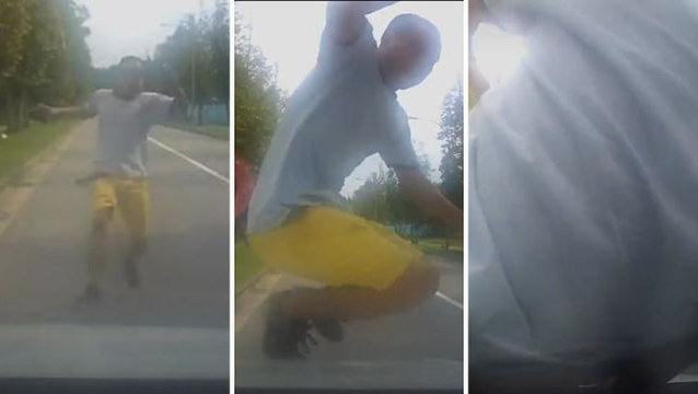 Man caught on video hurling himself onto car in Singapore