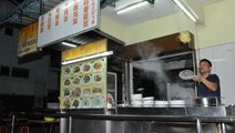 This food stall serves “flying noodles”
