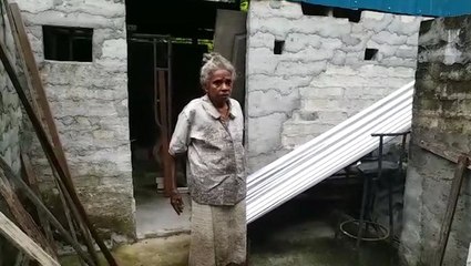 Senior citizen happy living in run-down home