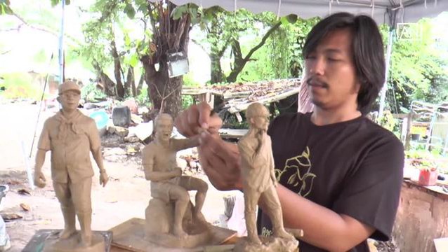 Artist makes figurines of cave heroes