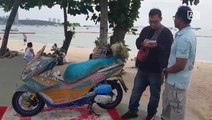 Thai royalist decorates motorbike in honour of late King