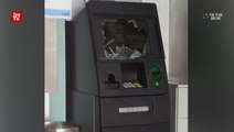 ATM vandalised by hammer-wielding man