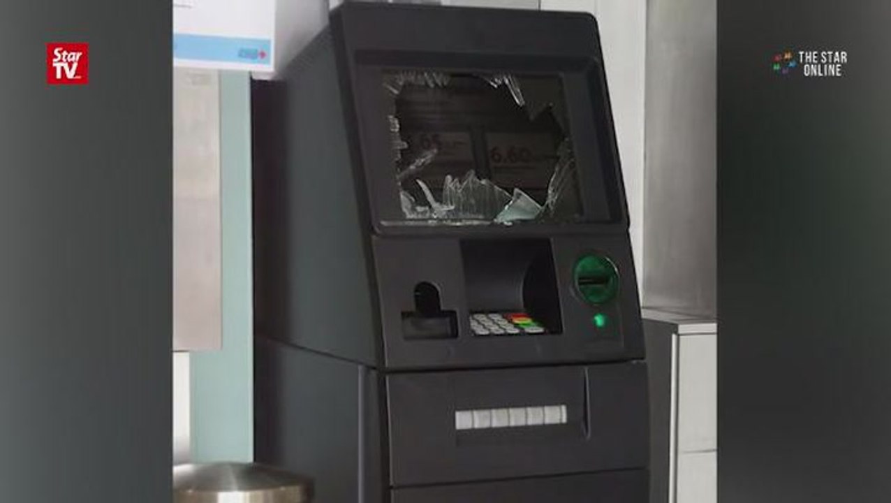 ATM vandalised by hammer-wielding man