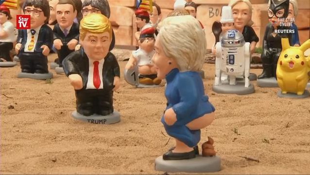 Pooper figurines of Clinton and Trump