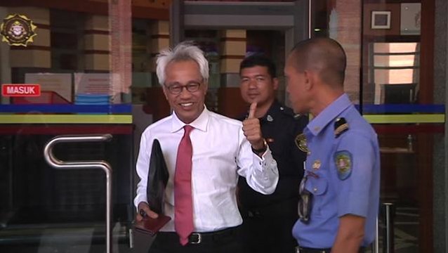 Two FIC officers arrive at MACC HQ for questioning