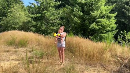 Mom Juggles 5 Balls While Holding Baby