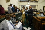 Zimbabwe opposition MPs removed from parliament after refusing to stand when president entered
