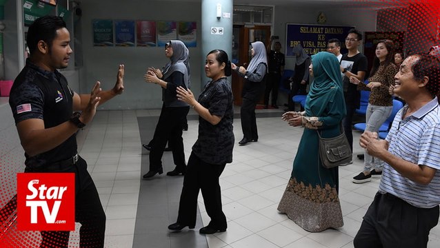 Aerobics at Penang immigration office breaks the ice