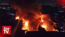 Massive fire engulfs warehouse in downtown Lima