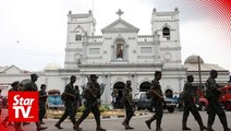 Police find explosives after shooting erupts during raid in a house in Sri Lanka