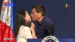 Philippines' Duterte stirs controversy by kissing woman on lips